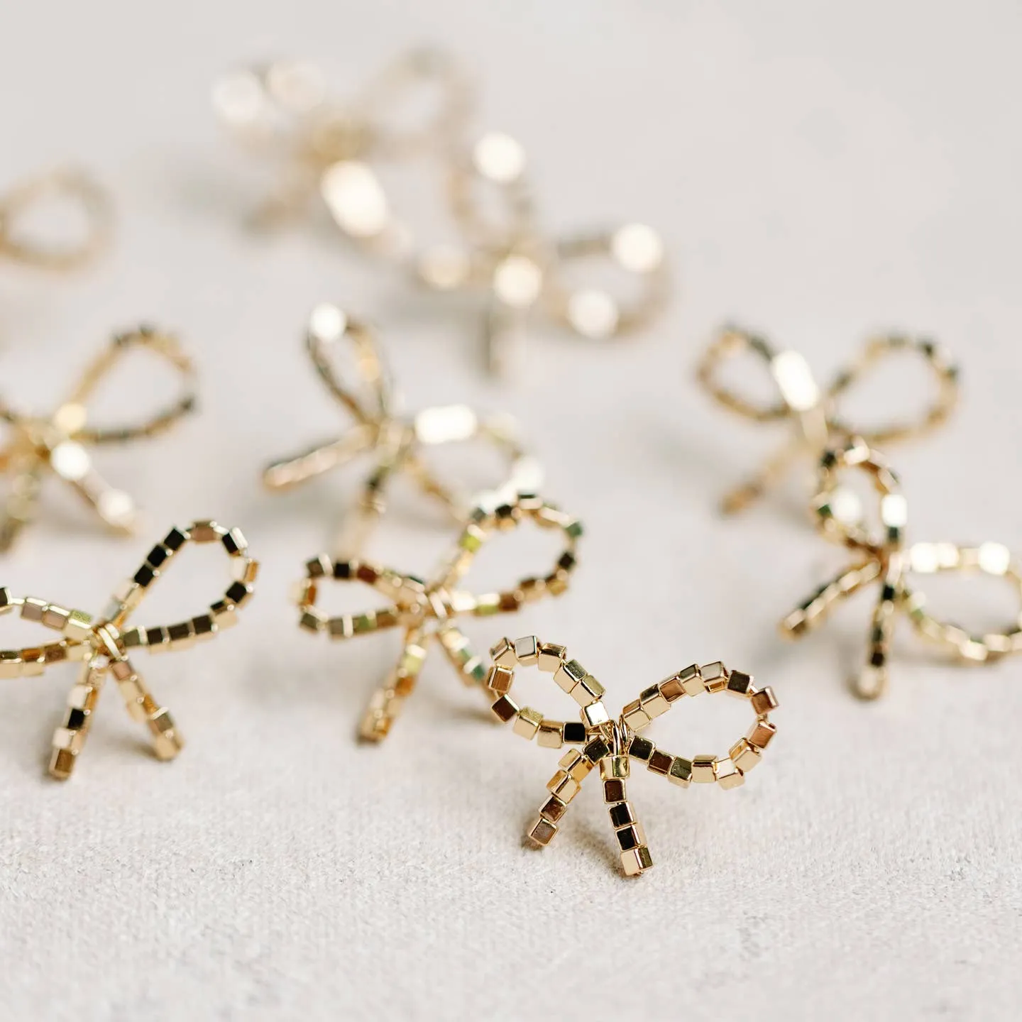 Mini Gold Beaded Statement Bow Earrings